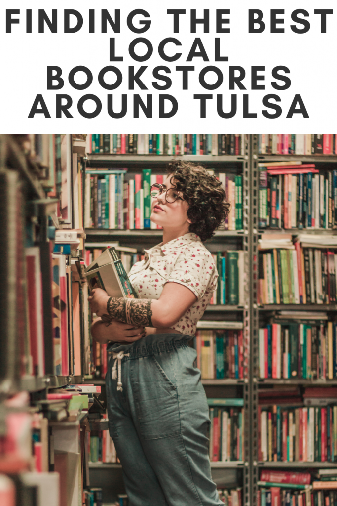 Woman in polka-dotted shirt searching for a book on a filled bookshelf