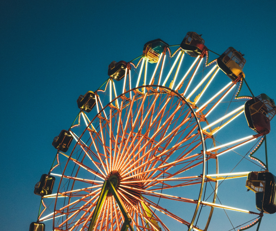 Ferris wheel lit up at dusk