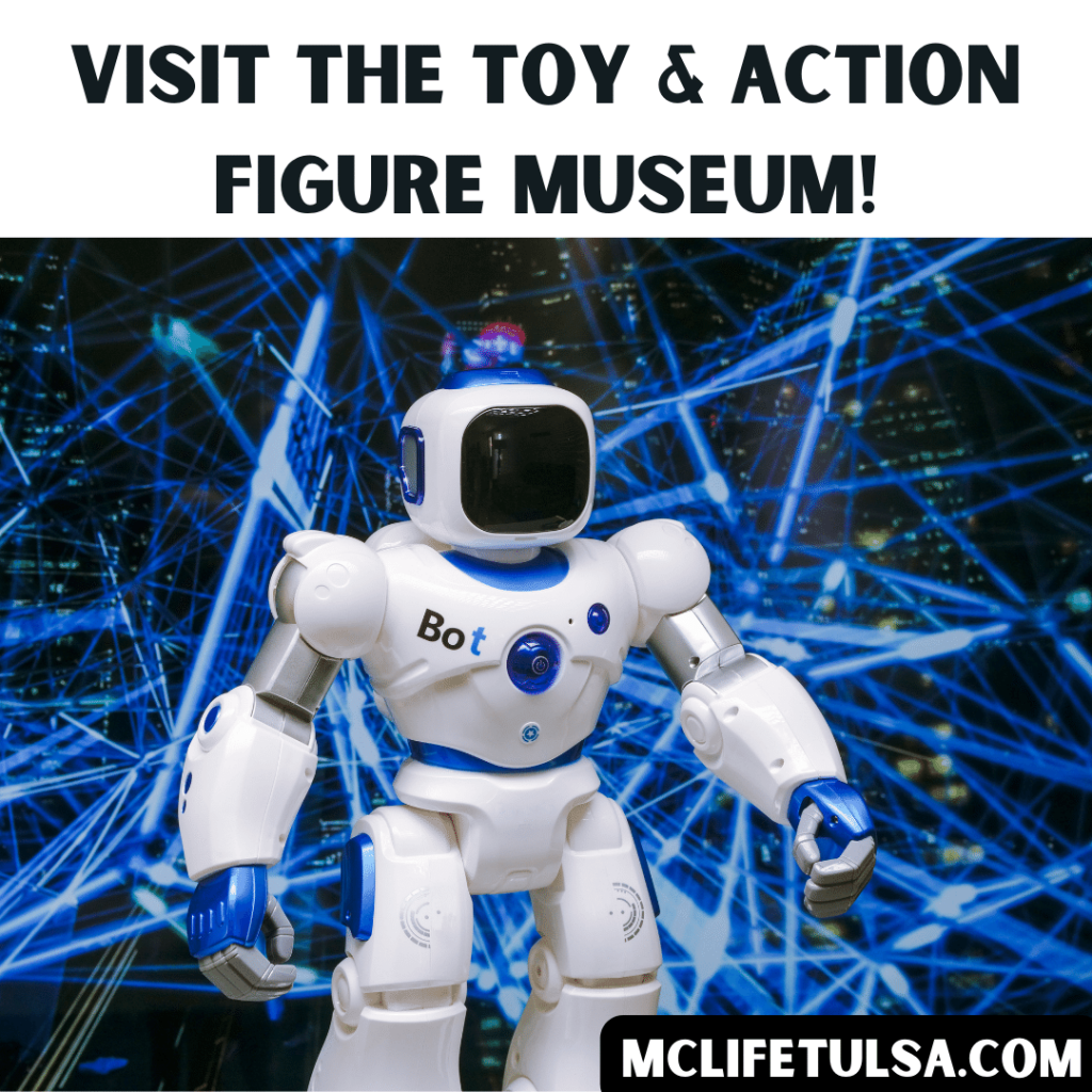 Image of white toy robot with black and blue laser background behind.