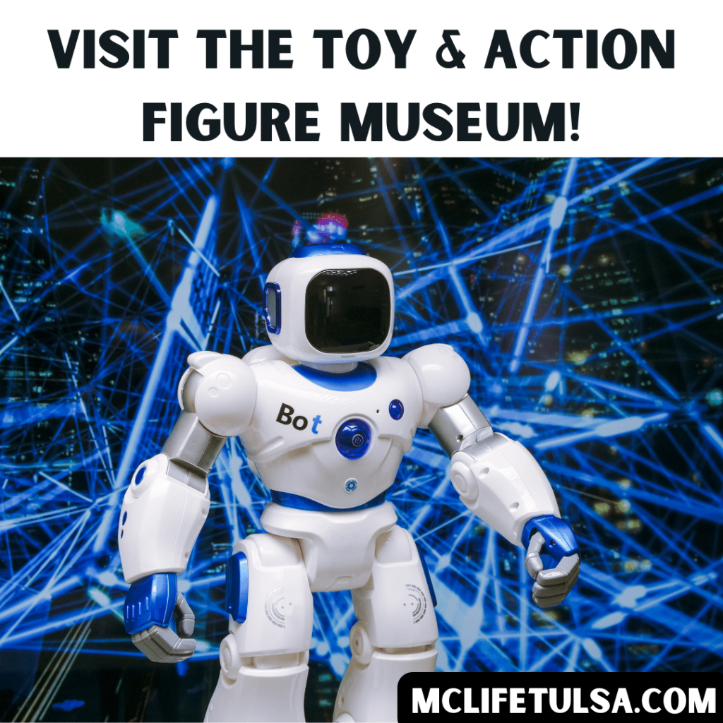 Image of white toy robot with black and blue laser background behind.  