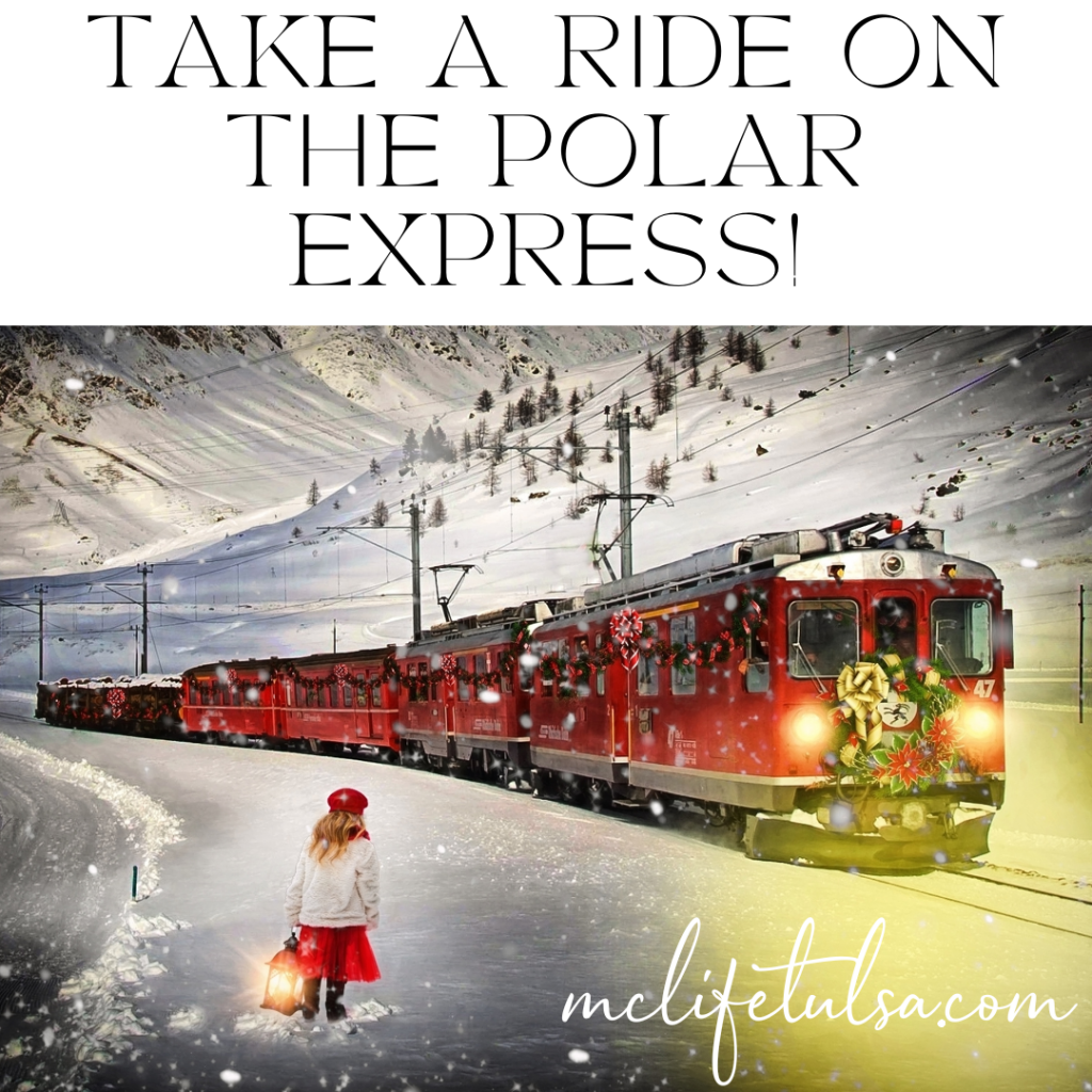 Image of young girl wearing a red skirt and white sweater standing in a snowy field, facing away from us. In front of her is a red train decorated for Christmas. White covered mountains are in the background.  